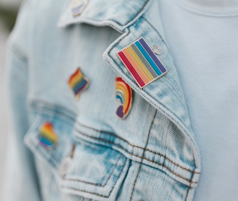 Pride pin on jean jacket