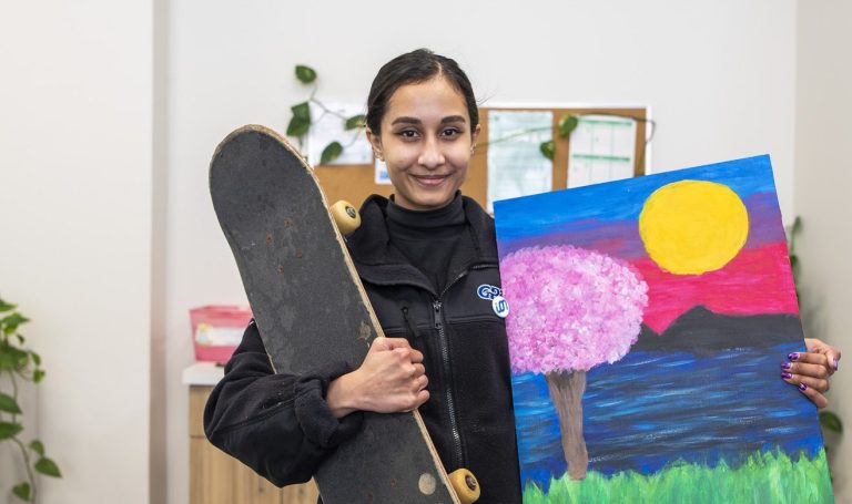 Customer Service Agent Nirali Patel is shown with items from GRT’s Lost and Found in January 2023.