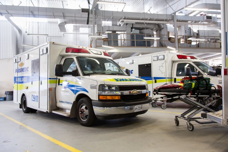 A Region of Waterloo ambulance parked in a garage.