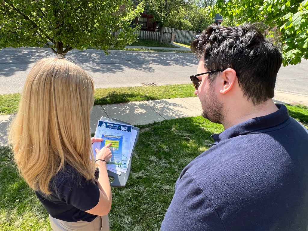 A Region of Waterloo staff member explains the Water Conservation By-law.
