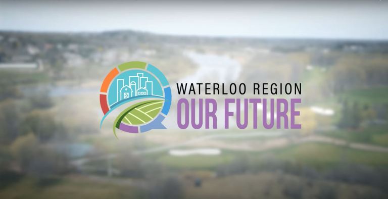 Aerial view of the Region of Waterloo, with a colourful logo that says "Waterloo Region, Our Future."