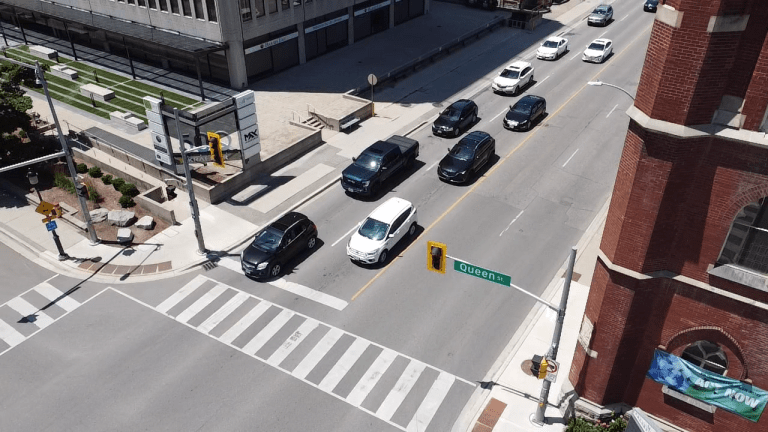 Cars lined up at the intersection of Queen and Weber Streets in Kitchener.