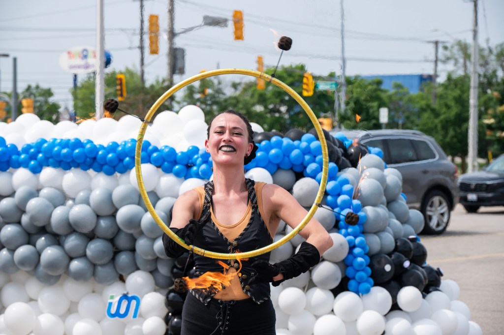 A performer holds a hoop at ION's 5th anniversary.