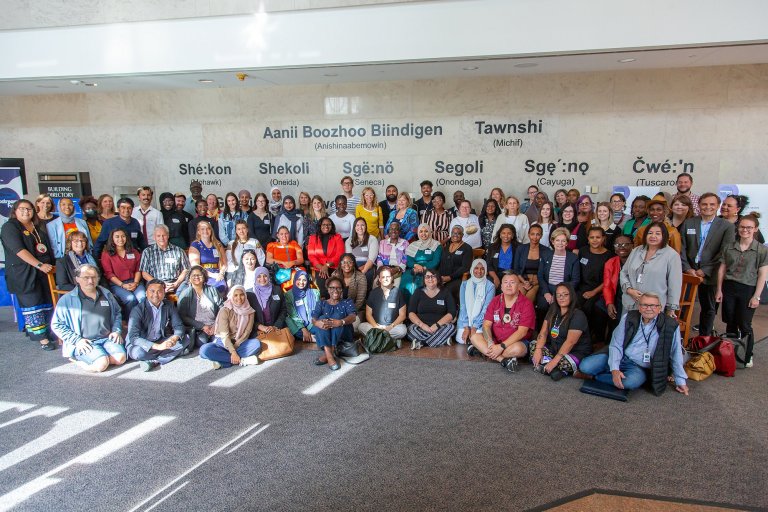 A large group of people pose for a photo at Region of Waterloo headquarters.