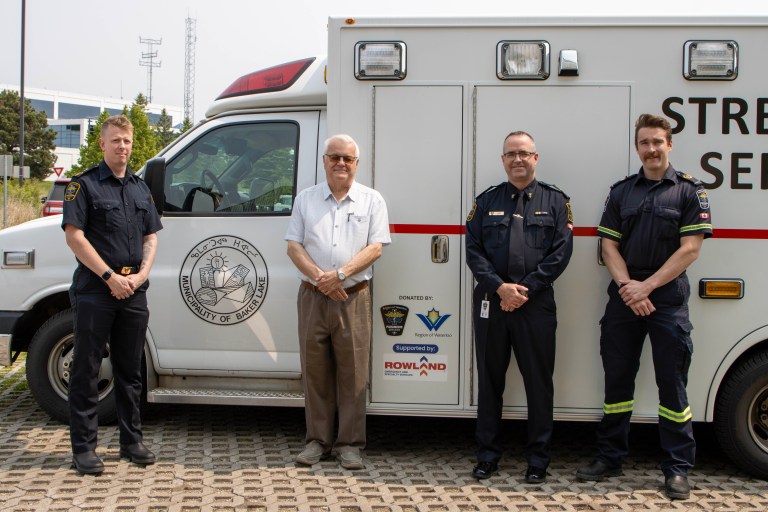 Paramedic Services staff stand in front of the ambulance that they donated to Baker Lake, Nunavut.