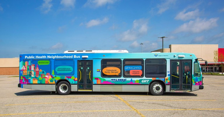 A GRT bus covered with colourful artwork.